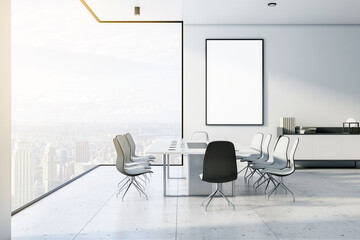 Blank white poster in black frame in stylish meeting room with light conference table and chairs,...