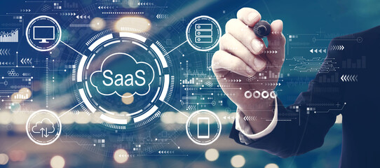 SaaS - software as a service concept with a man on city background