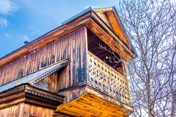 An old two-story wooden house in the village.