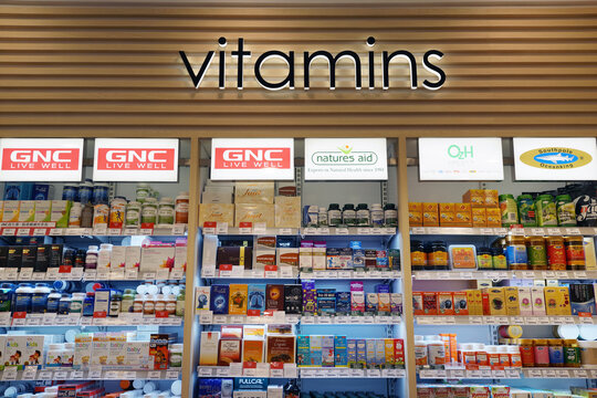 Various brands of vitamins and supplements on store shelves in Changi Airport. Multivitamins were found to be the most commonly used supplement. Singapore - JAN 6, 2019.