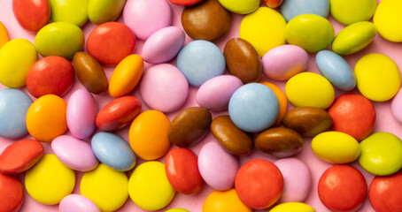 Colorful chocolate candy smarties background.