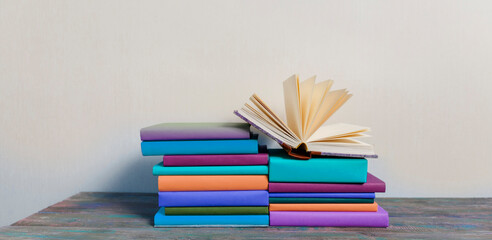 Opened Book on a pile of books