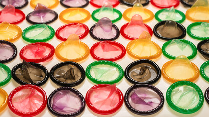 Colorful condoms background.