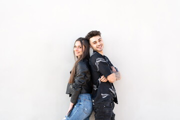 Couple back to back on white background