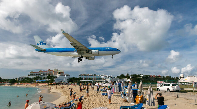 KLM passenger jet is about to land at the Princess Juliana airport.
