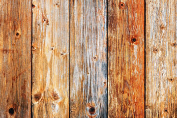 Texture of the planks of an old wooden table in antiqued pastel colors. Vintage rustic wooden background. Carpentry.