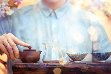 spring tea ceremony in asia, abstract fresh garden background man master
