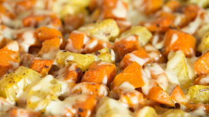 A dish of pumpkin and potatoes in sour cream sauce