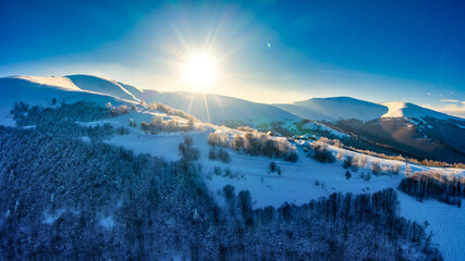 Wonderful landscapes of the Carpathian Mountains covered with snow and clear blue sky in Ukraine...