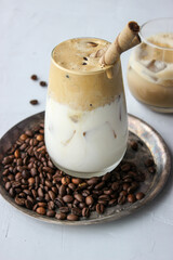 Cold coffee with foam and sweet straw