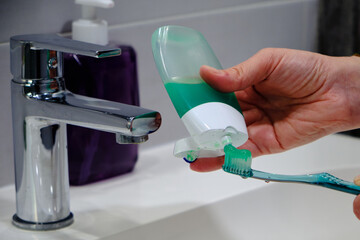 Toothbrush with green toothpaste tube