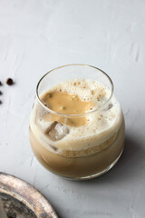 Cold coffee with foam and sweet straw