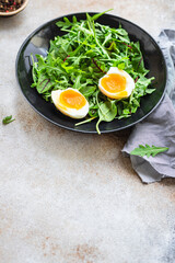 fresh salad egg lettuce leaves mix arugula, chard healthy meal copy space food background. top view diet vegan or vegetarian food