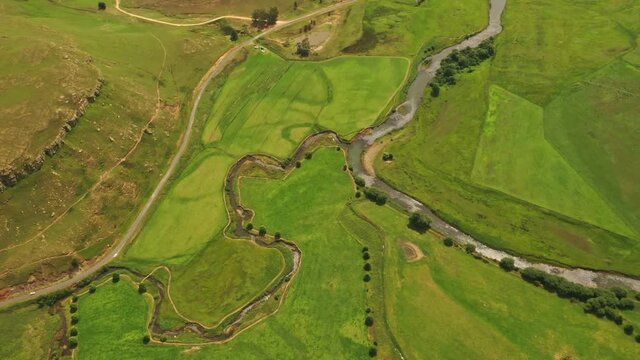 Umgeni River winding through the lush green KwaZulu-Natal, South Africa - Aerial fly-over shot