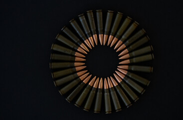Cartridges for AKM 7.62x39 in the form of a circle on a black background