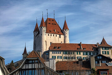 Castle towers above the roofs of the old city of Thun, Switzerland