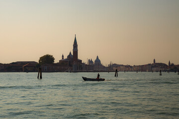 Approaching Venice in Italy at dusk by vaporetto or water bus.