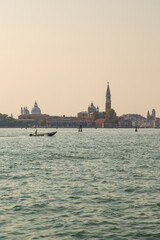 Approaching Venice in Italy at dusk by vaporetto or water bus.