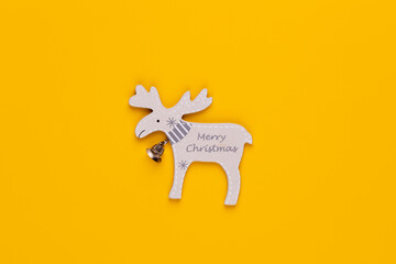 Christmas star decor on yellow colored background.