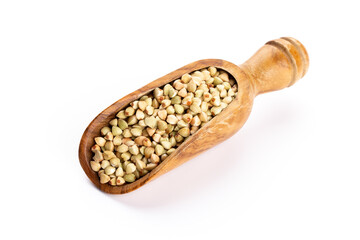 Raw buckwheat and wooden spoon on white background.