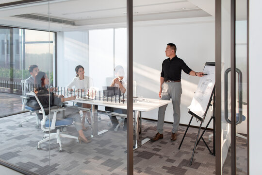 Business people having meeting in board room