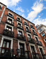 Fototapeta premium Old colorful historic facades of buildings in the center of Madrid city, Spain.