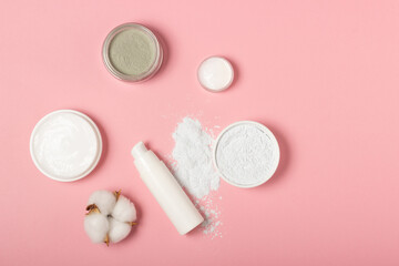 Alginate and clay face masks. Cosmetic products, masks and creams in jars. Top view, flat lay