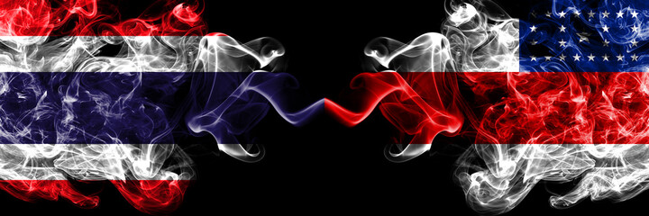 Thailand, Thai vs Brazil, Brazilian, Amazonas smoky mystic flags placed side by side. Thick colored silky abstract smokes flags.