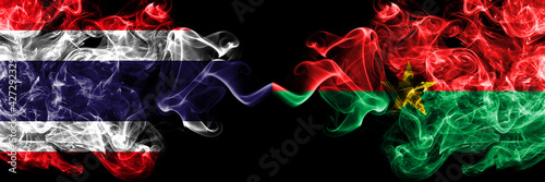 Thailand, Thai vs Burkina Faso, Burkinese smoky mystic flags placed side by side. Thick colored silky abstract smokes flags.