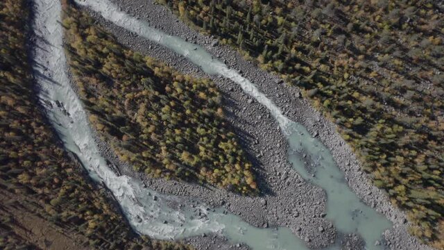 Aerial footage of a beautiful glacier river on a sunny day. Captured in 4k.