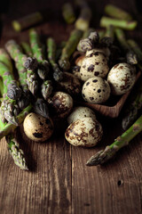 Raw asparagus and quail eggs.