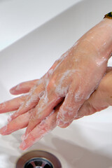 Wash hands by rubbing with soap for prevention of corona virus, hygiene to stop spreading coronavirus.
