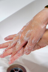 Fototapeta premium Wash hands by rubbing with soap for prevention of corona virus, hygiene to stop spreading coronavirus.