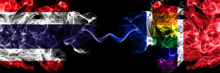 Thailand, Thai vs France Gay flag smoky mystic flags placed side by side. Thick colored silky abstract smokes flags.