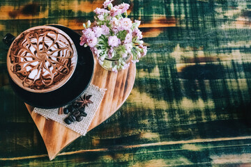 Latte on a texture table in a black cup