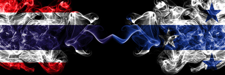 Thailand, Thai vs Gambier Islands smoky mystic flags placed side by side. Thick colored silky abstract smokes flags.