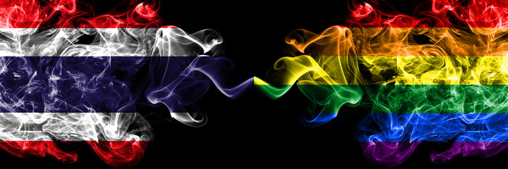 Thailand, Thai vs Gay, Pride smoky mystic flags placed side by side. Thick colored silky abstract smokes flags.