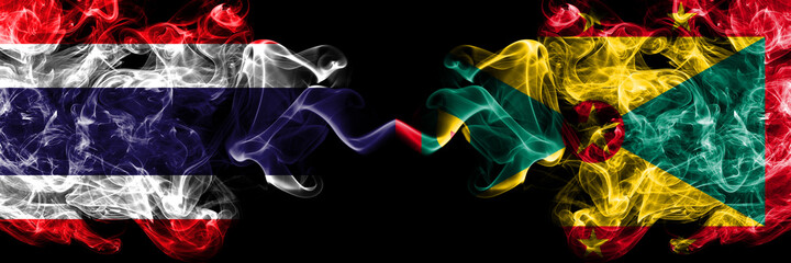 Thailand, Thai vs Grenada smoky mystic flags placed side by side. Thick colored silky abstract smokes flags.