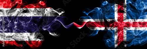 Thailand, Thai vs Iceland, Icelandic smoky mystic flags placed side by side. Thick colored silky abstract smokes flags.