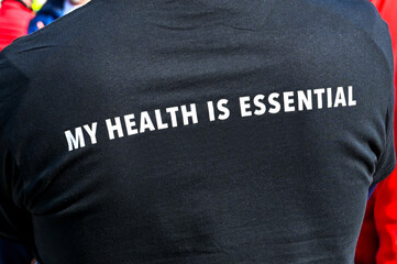 Fototapeta na wymiar Message about the importance of health on the back of a person's T shirt.