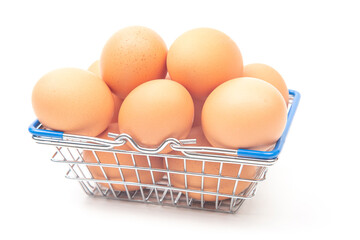 chicken eggs in a supermarket grocery basket on a white background.