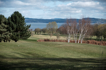 Fototapeta na wymiar Golfing area. Spring landscape in Scotland. Background pattern.
