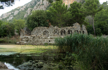 Destroyed wall with arc windows. The Ruins Of The Ancient City Of Olympos (Cirali, Antalya region, Turkey).