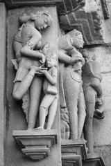 Stone carved erotic bas-relief in Hindu temple in Khajuraho, India.
