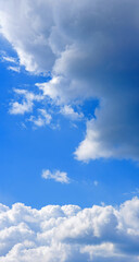 Obraz premium Vertical panorama of the blue clear sky. Blue sky on a sunny day.