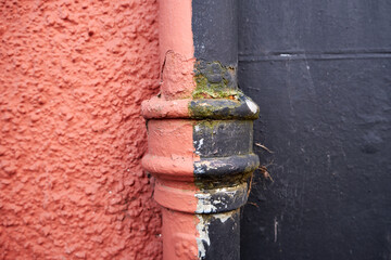 Old drain pipes outside the buildings in Edinburgh. Background pattern for an artistic work.