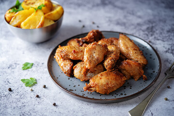 Spicy baked wings in a plate