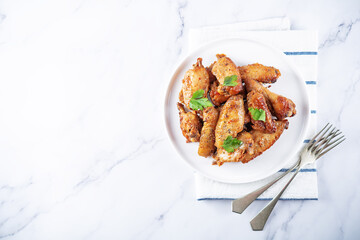 Spicy baked wings in a plate
