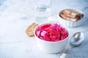 Fresh raw pickled beet cabbage with casrrot in a bowl