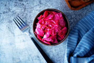 Fresh raw pickled beet cabbage with casrrot in a bowl